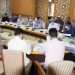 Div Com reviews progress on Transit Room Tenements other migrant issues